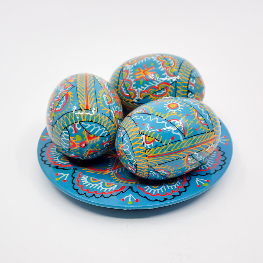 UKRAINIAN WOODEN PYSANKY HAND DECORATED EASTER EGGS ON A PLATE TEAL