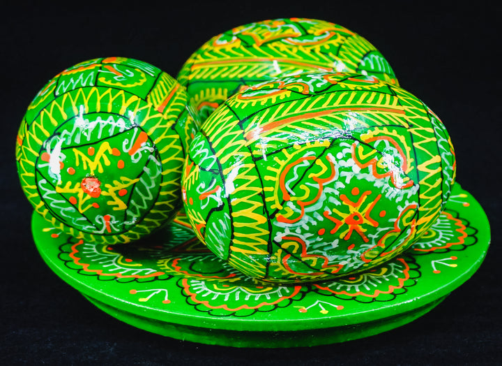 3 UKRAINIAN WOODEN PYSANKY HAND DECORATED EASTER EGGS ON A PLATE GREEN