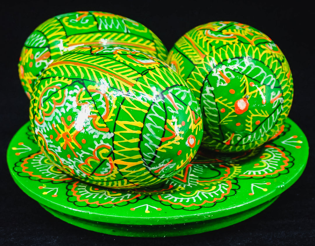 3 UKRAINIAN WOODEN PYSANKY HAND DECORATED EASTER EGGS ON A PLATE GREEN