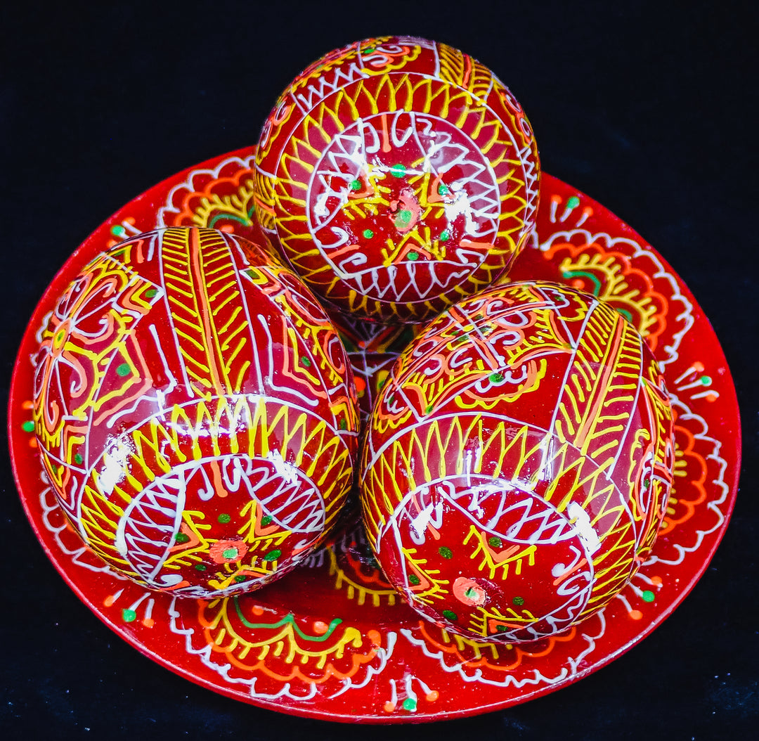 3 UKRAINIAN WOODEN PYSANKY HAND DECORATED EASTER EGGS ON A PLATE